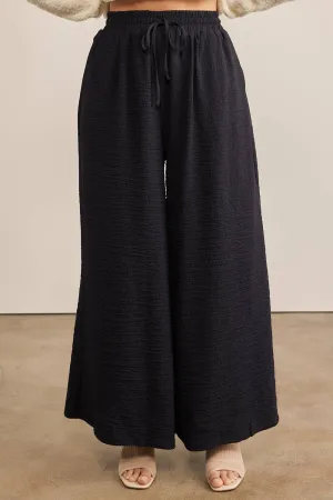 FLOWY WIDE LEG PANTS IN TEXTURED WAFFLE FABRIC