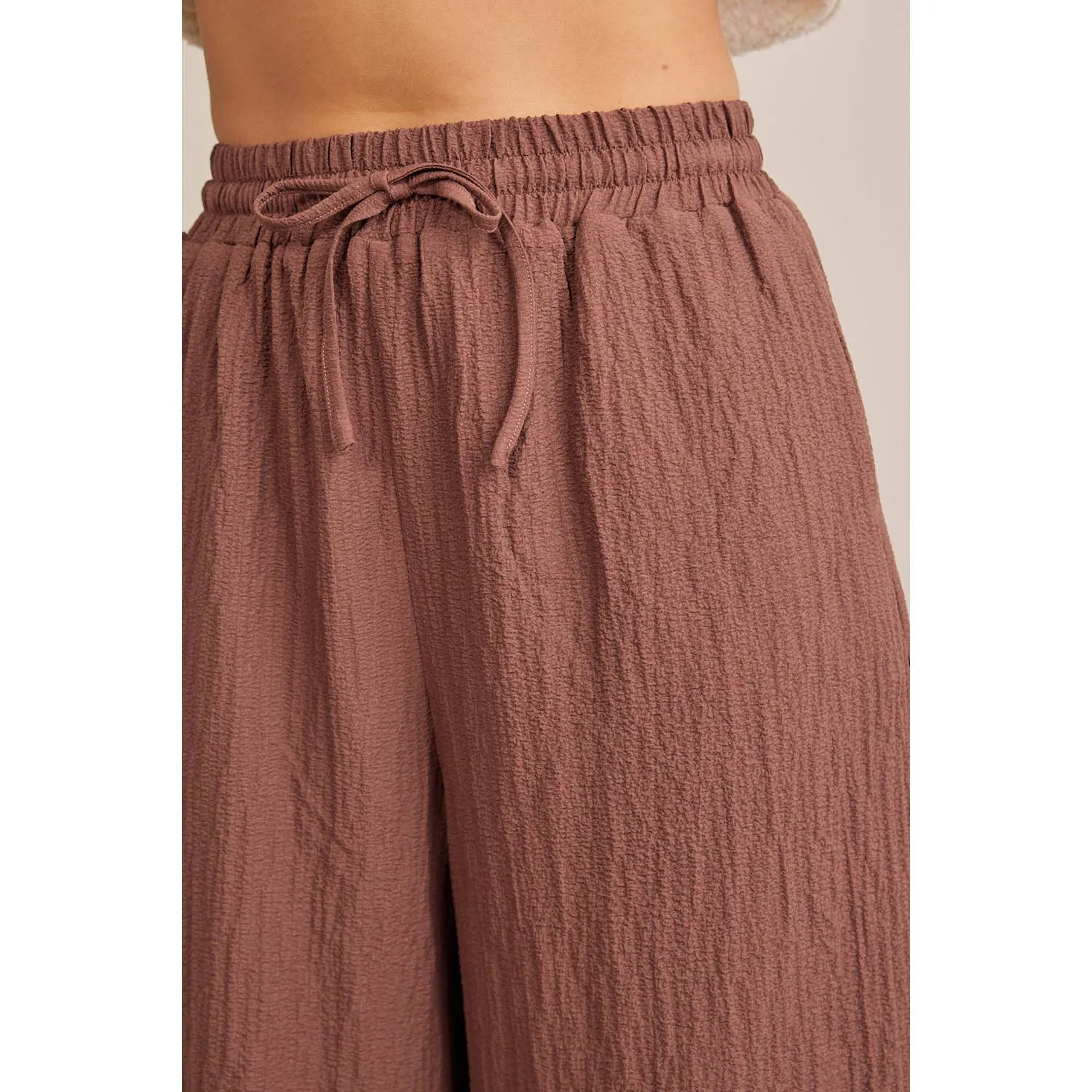 FLOWY WIDE LEG PANTS IN TEXTURED WAFFLE FABRIC