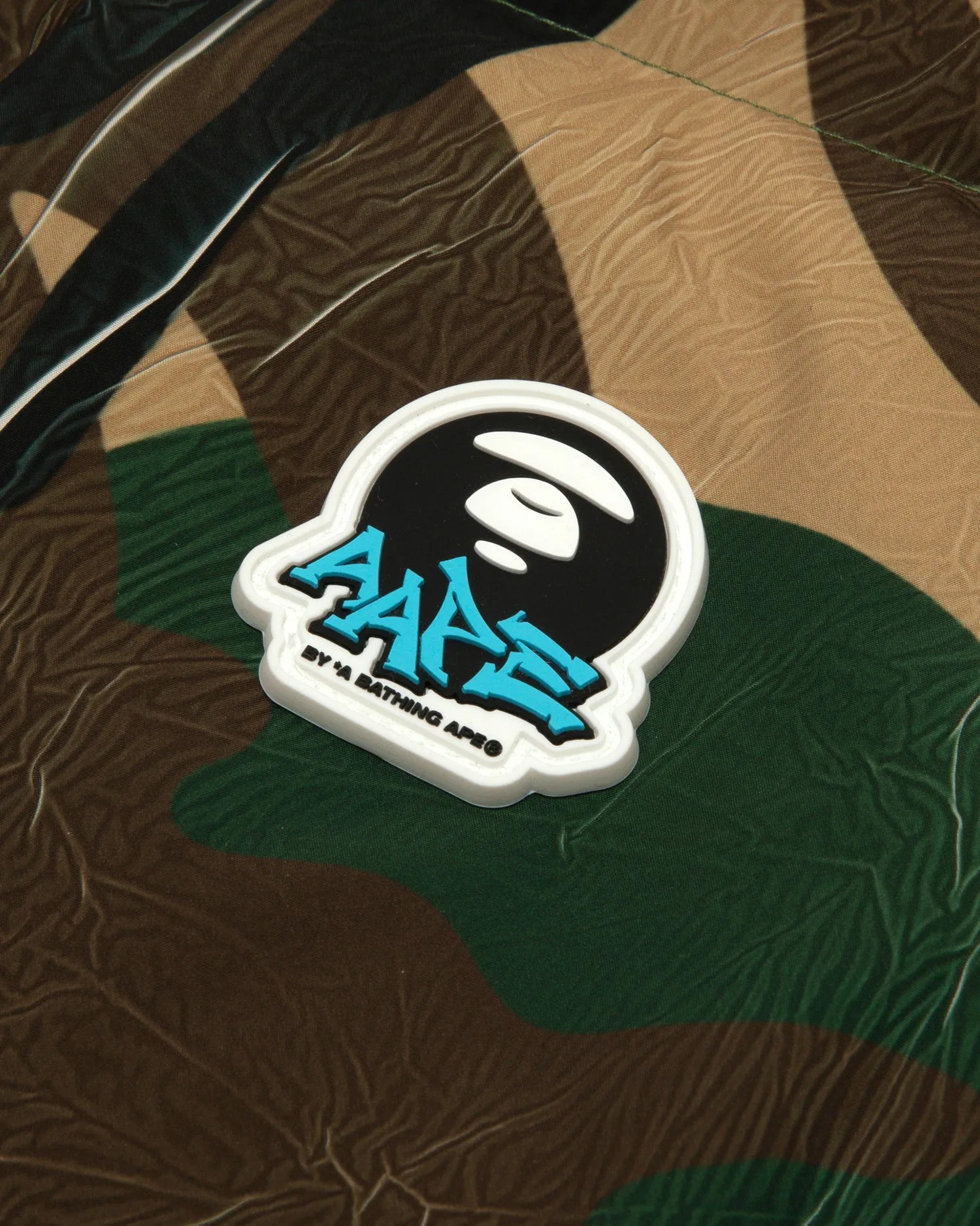 Moonface logo camo hooded puffer jacket